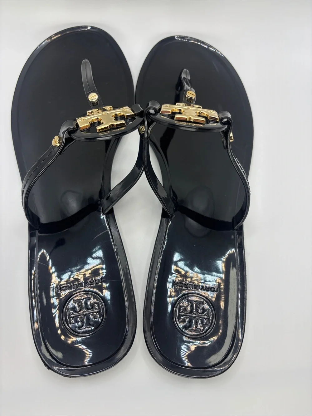 Tory Burch Black Jelly Thong Sandals with Gold Logo Medallions